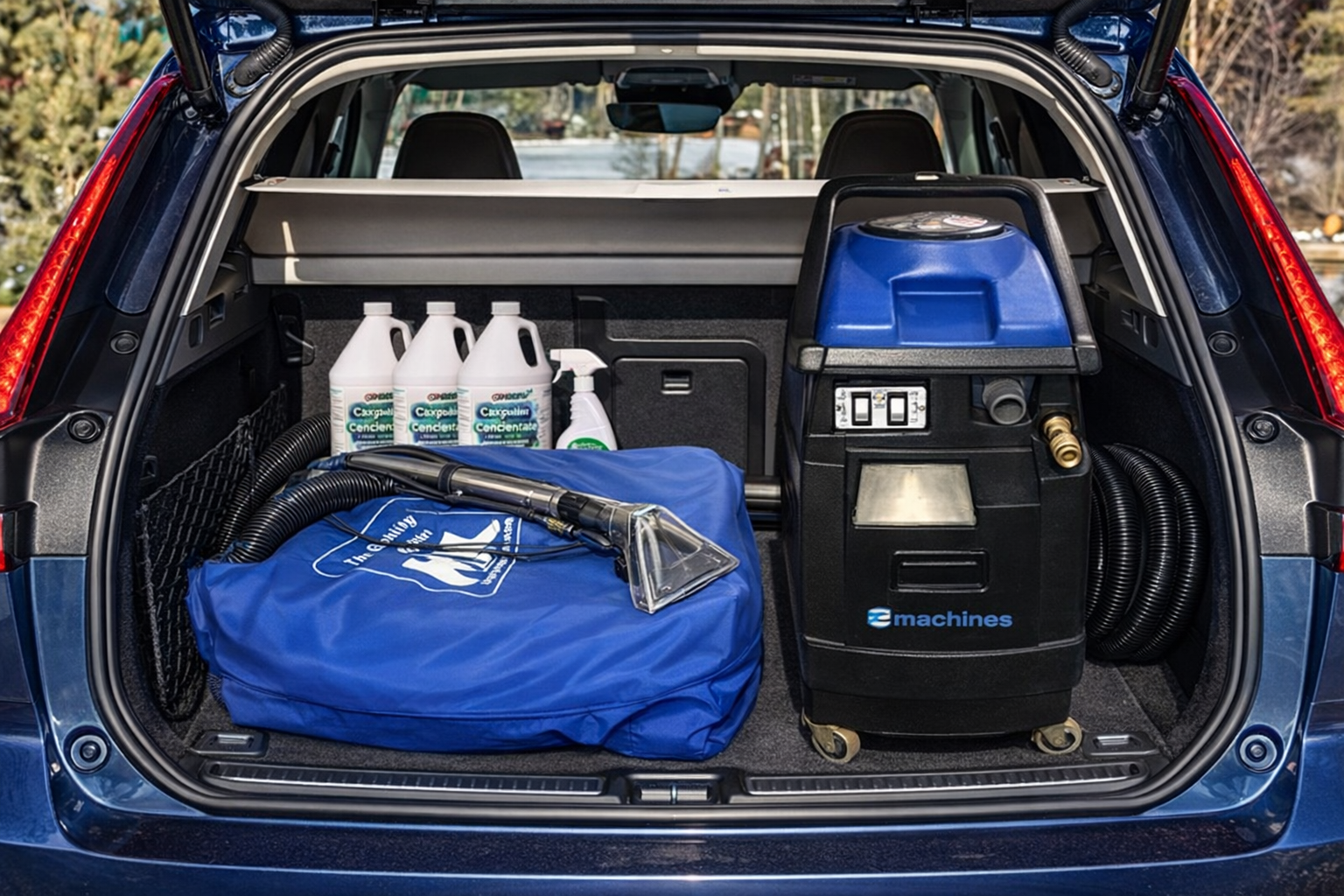 E600 carpet cleaning machine Car trunk with cleaning equipment including a pressure washer and bottles.