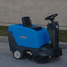 Right-angled view of Johnny Vac Industrial Ride-On Sweeper Machine JVC40SWEEPN on the road